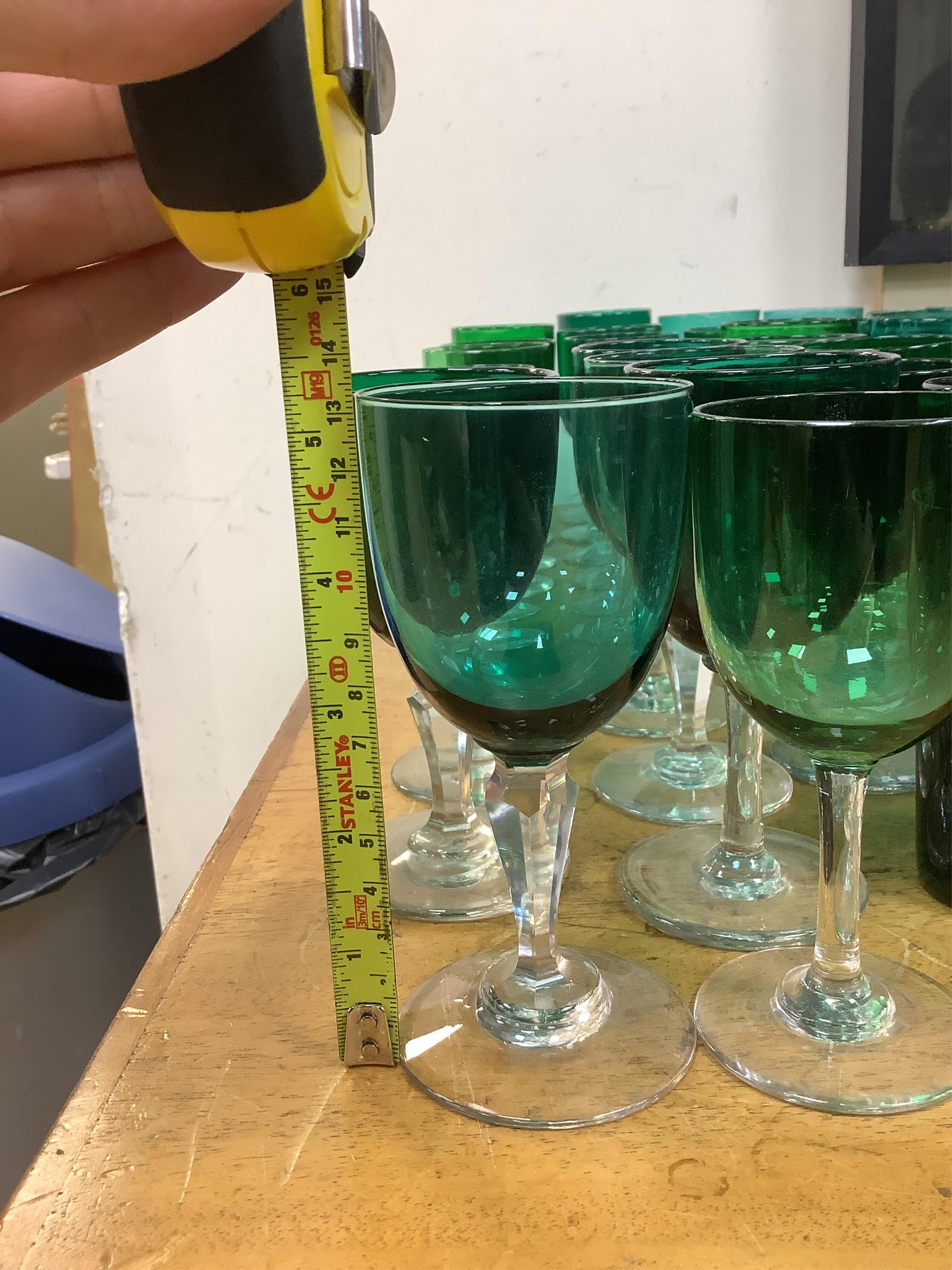 A collection of Victorian green glassware including a claret jug, 24cm. Condition - mostly good